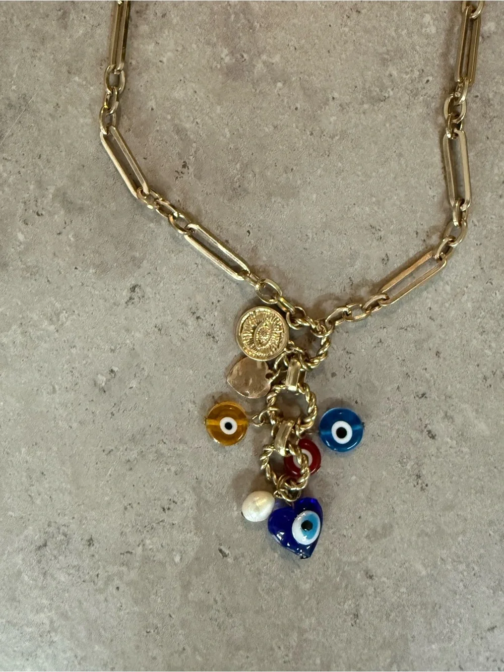REVOLVE Gold Charm Necklace with Blue, Yellow, Red and White Evil Eye Accents